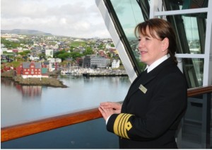  - Captain-Inger-Olsen-takes-in-the-view-of-Torshavn-from-the-Bridge-of-Queen-Victoria-300x212