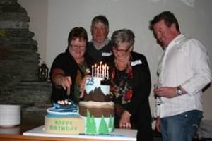 Pictured here with the Dart River Jet Cake are [L-R] founders Robyn Ross and Neil Ross, Lorraine Lindsay & Dart River Jet General Manager Clark Scott.